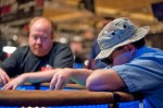 Darren Shebell counts out chips while Dan Heimiller observes.