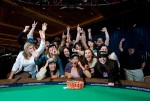 Newly crowned 2010 WSOP Ladies Champion, Vanessa Hellebuyck, lets loose while posing with her supporters.