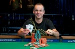 Steve Jelinek poses with the bracelet after taking down event #41