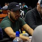 Jay Lee scoops a pot on Day 2