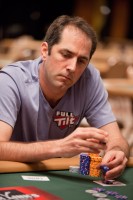 Phil Gordon tosses some chips into the pot.