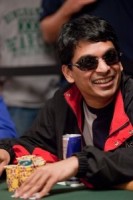 Venkatesh Gupta smiles at his opponent before making his next move. 