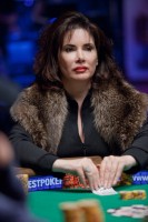 Timmi DeRosa keeps warm at the final table.