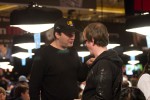 11-time bracelet winner, Phil Hellmuth, gives Dave 'Devilfish' Ulliott a talking to.