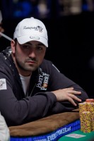 Joel Ettedgi sits in Seat 1 of the final table with his large stack of chips