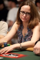 Jena Delk looks to her left to see if anyone will call her bet