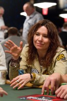 Annie Duke prepares for her cards to be dealt to her. 