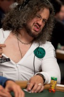 Joe Reitman protects his cards, but not his chest. 