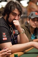 Hevad Khan watches the hand at his table. 