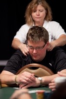 Sigurd Eskeland receives a massage while trying to cope with the pressure of the Main Event.