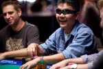 Yan Chen is all smiles as he works his way through the final table of Event 14.