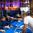 Guy Laliberté shakes hands with Paul Phua