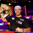 Michael Mizrachi holds aloft the David 