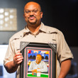 Corey Harrison displays his framed picture