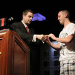 Jack Effel presenting the gold bracelet to Trevor Pope