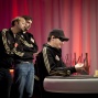 Daniel Negreanu and Jason Mercier look on at Phil Hellmuth heads up