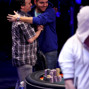 John Hewitt, right, gets a hug from November Nine chip leader Martin Staszko.