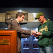 Jack Effel hands Jared Hamby his gold bracelet