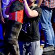 Trevor Pope is greeted by his dog, Revis, after winning event 02 at the WSOP.